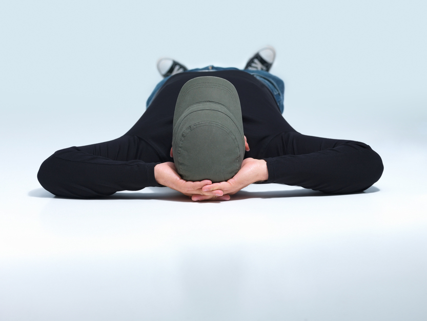 Modern person lying on floor with copyspace