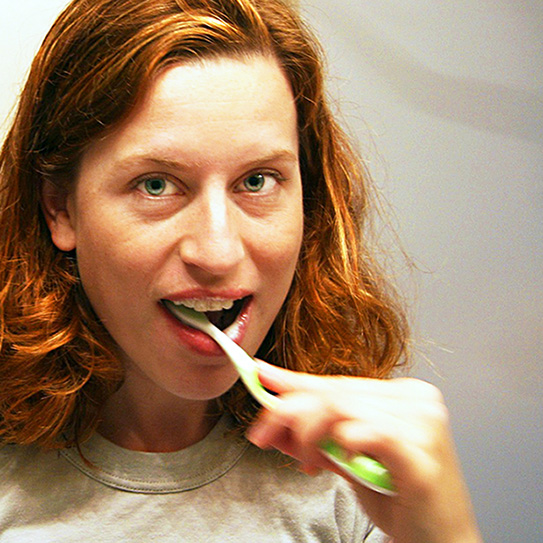 Woman Brushing Teeth